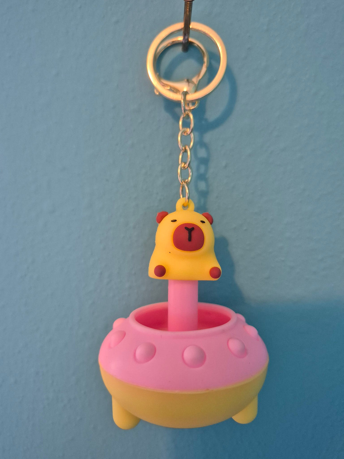 Capybara UFO Squeaky Keychain – Yellow and Pink Pop-Up Character Keychain That Squeaks - photo 1