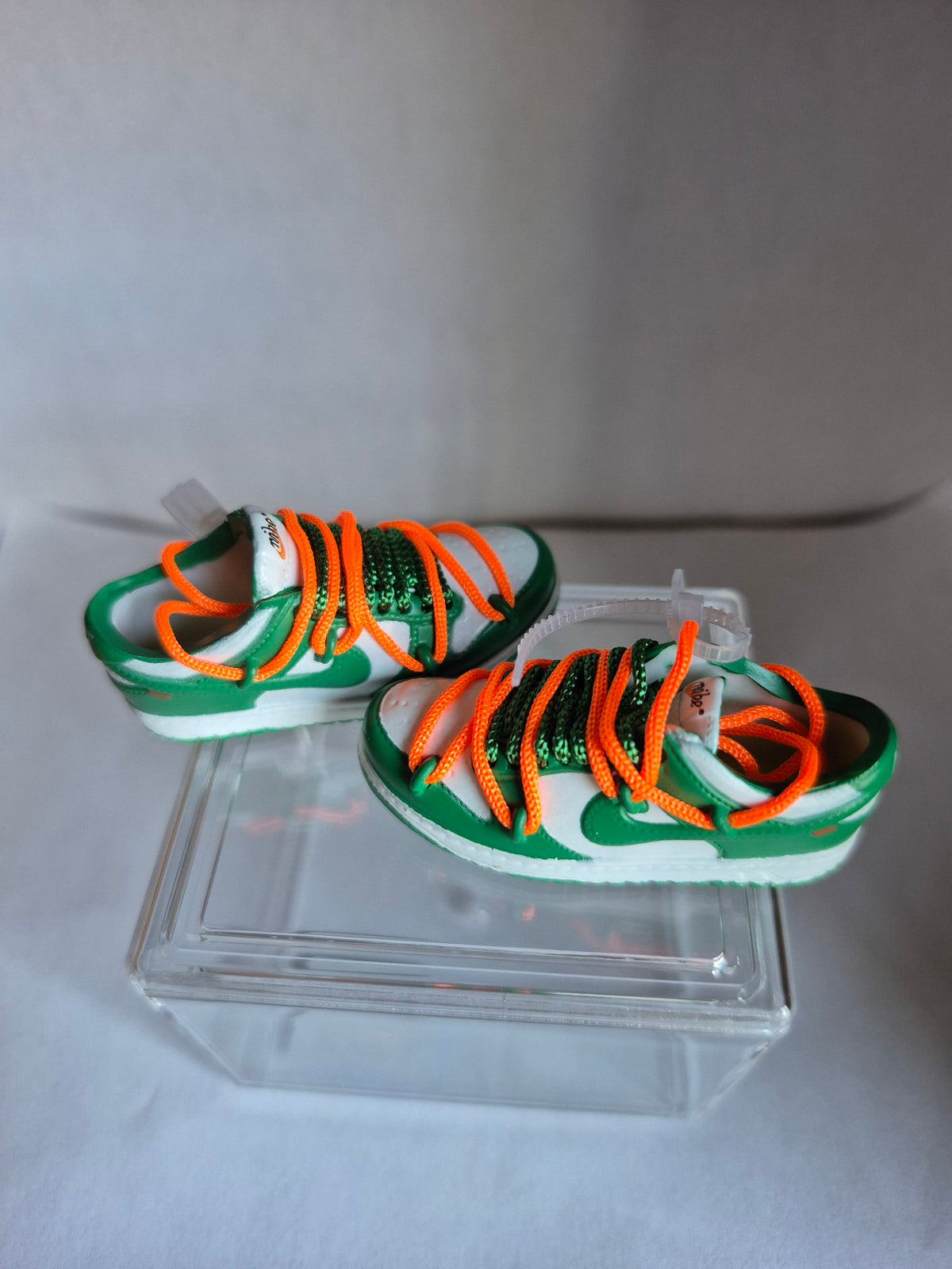 Green and White Mini Sneakers with Orange Laces – Collectible Pair with Display Case