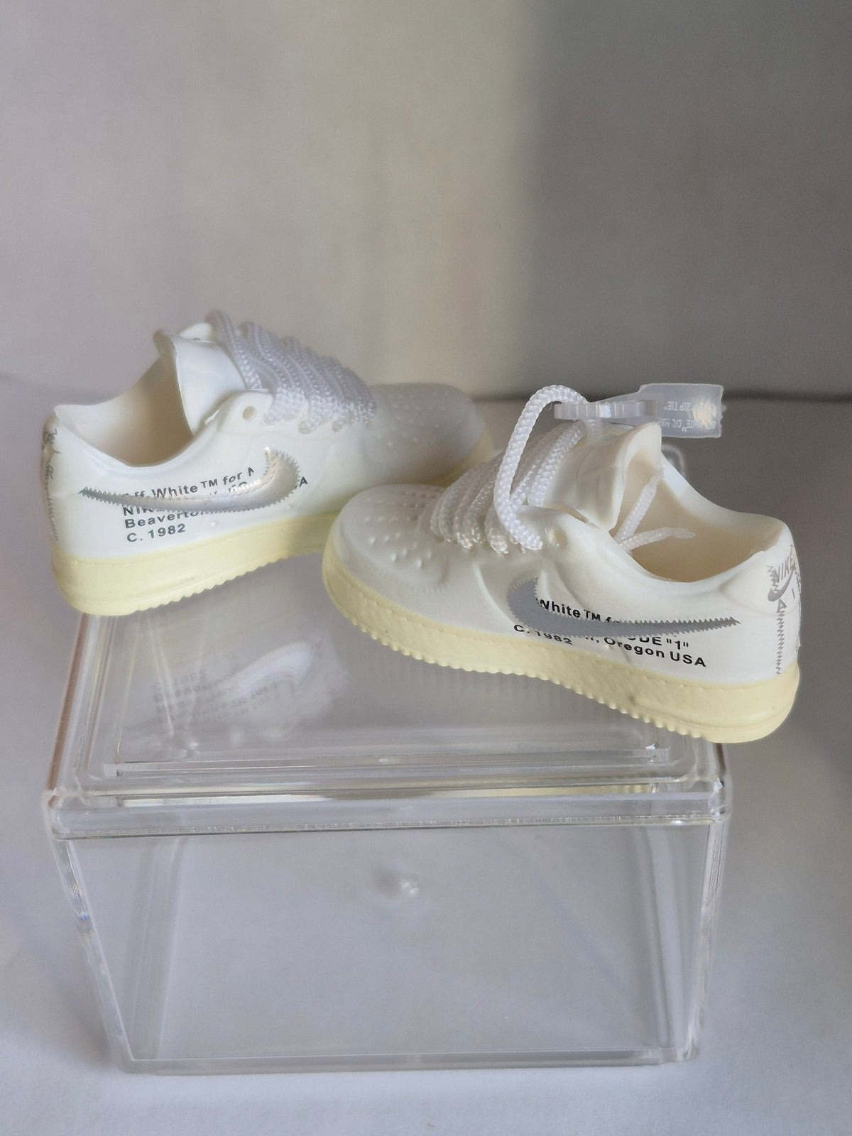 White Mini Sneakers with Gray Swoosh – Collectible Pair with Display Case