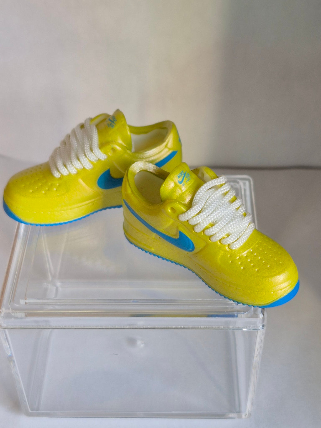 Yellow Mini Sneakers with Blue Swoosh – Collectible Pair with Display Case