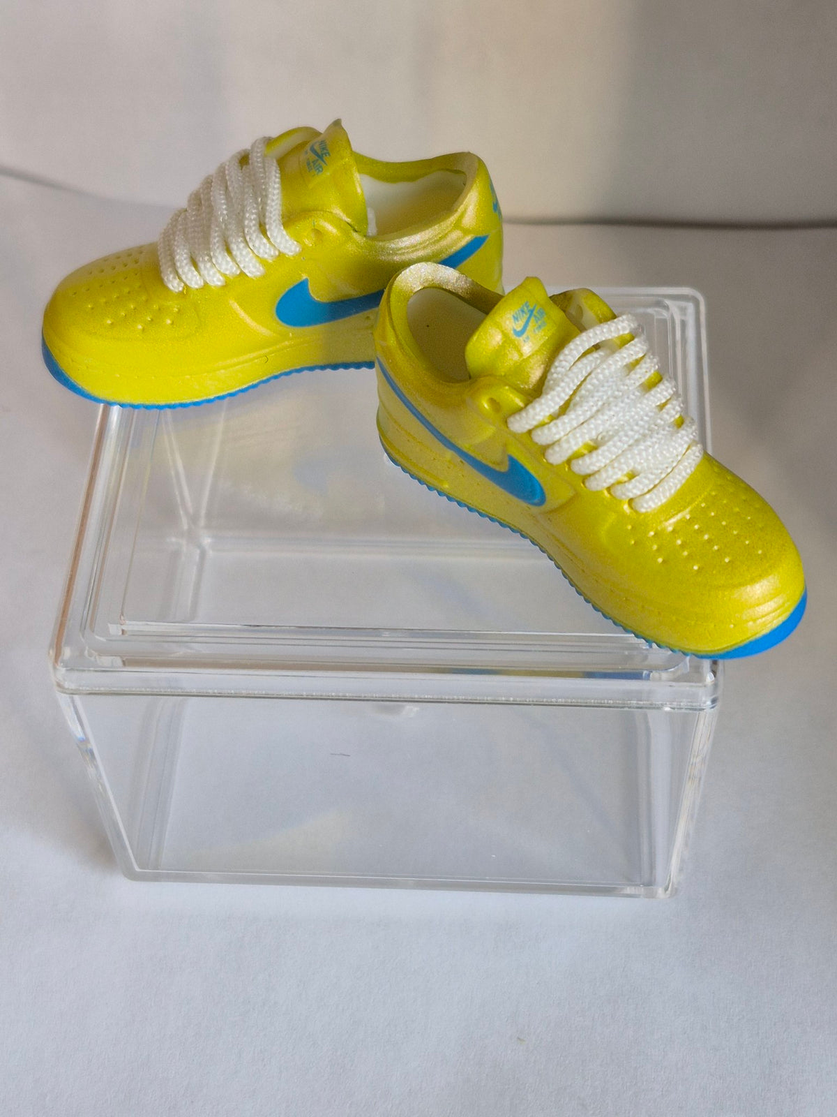 Yellow Mini Sneakers with Blue Swoosh – Collectible Pair with Display Case