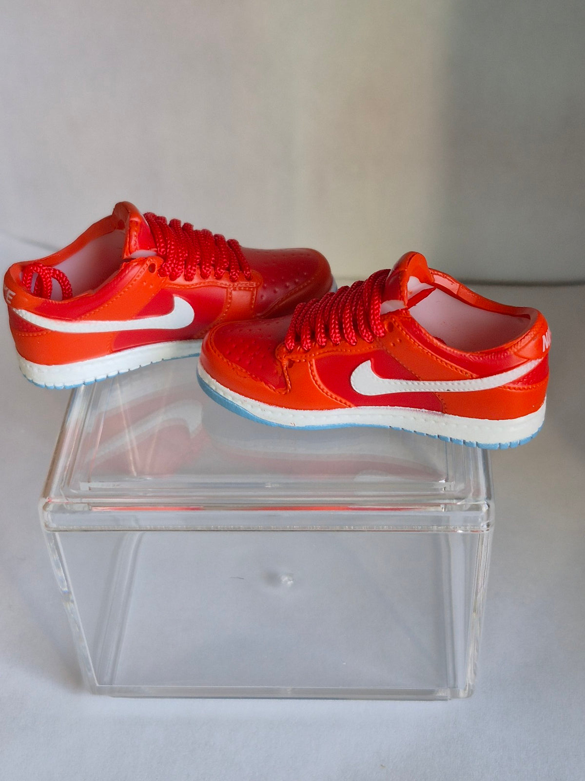 Orange-Red Mini Sneakers – Collectible Pair with Display Case