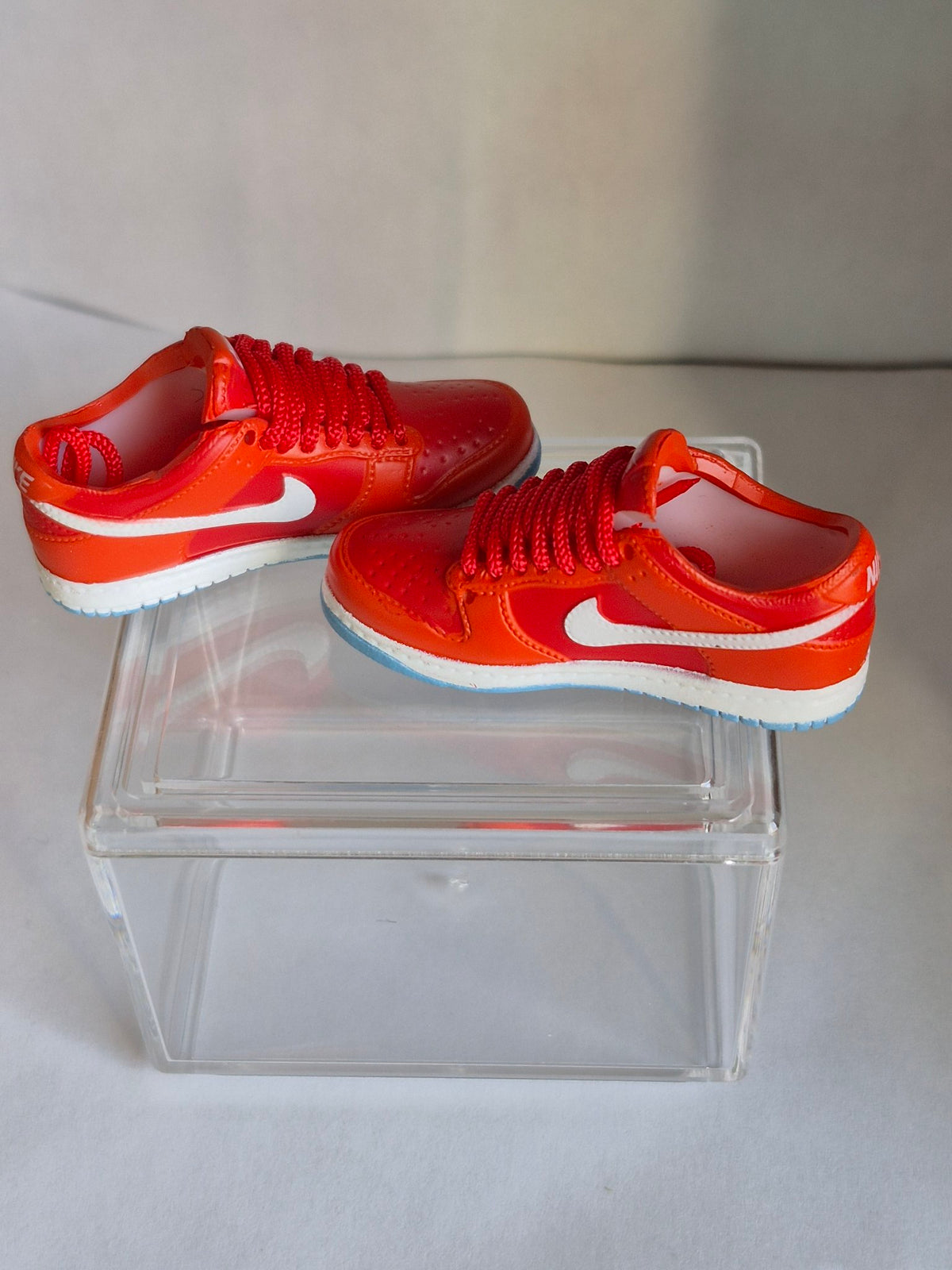 Orange-Red Mini Sneakers – Collectible Pair with Display Case