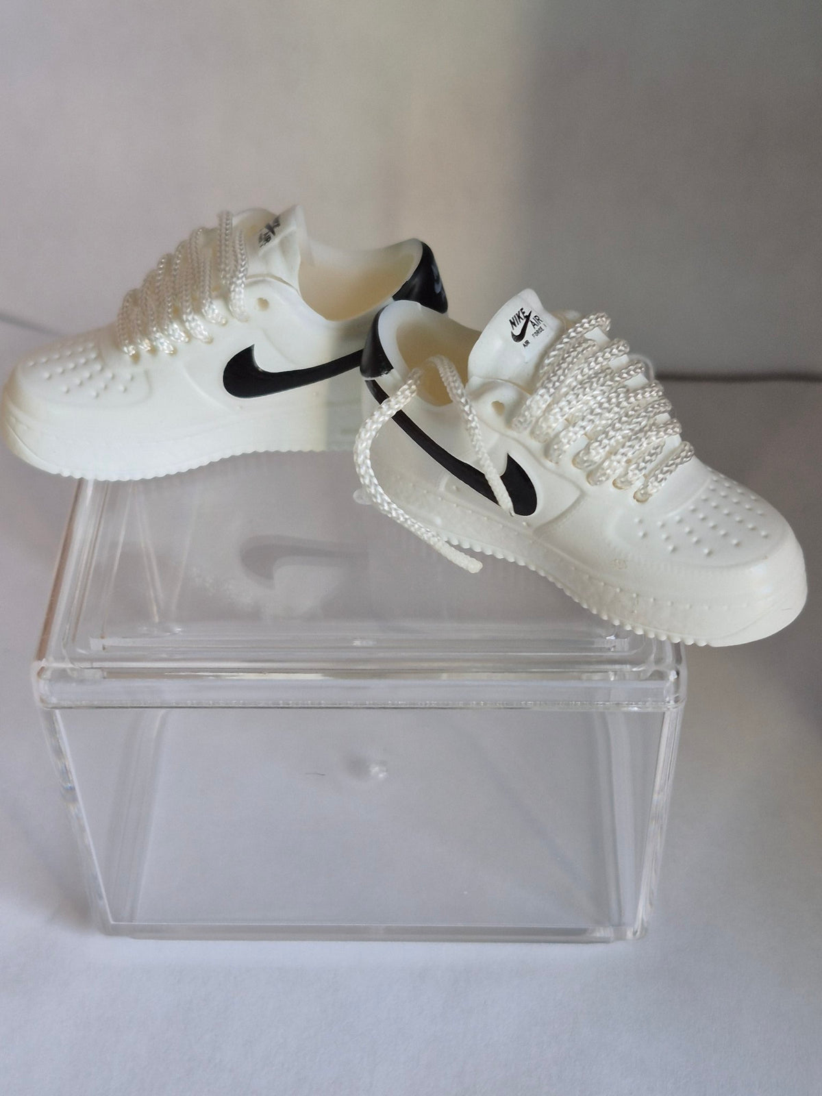 White Mini Sneakers with Black Swoosh – Collectible Pair with Display Case