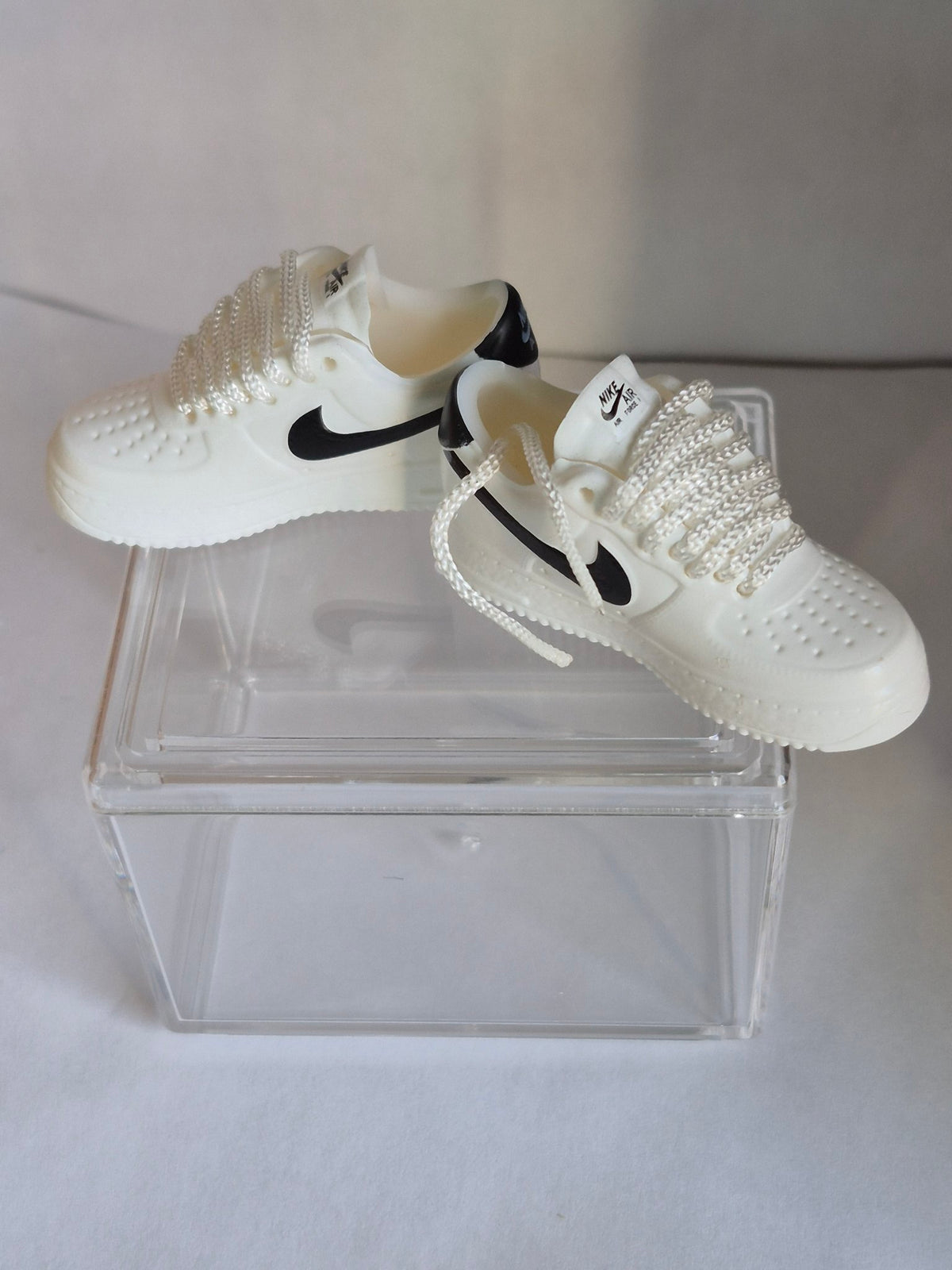 White Mini Sneakers with Black Swoosh – Collectible Pair with Display Case