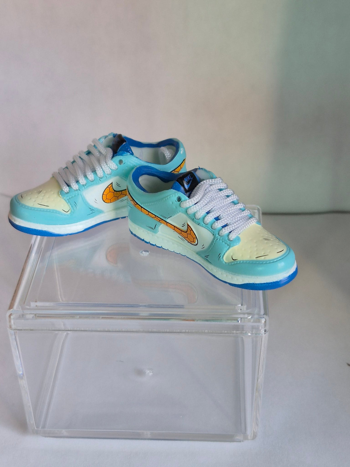 Light Blue Mini Sneakers with Honeycomb Swoosh – Collectible Pair with Display Case