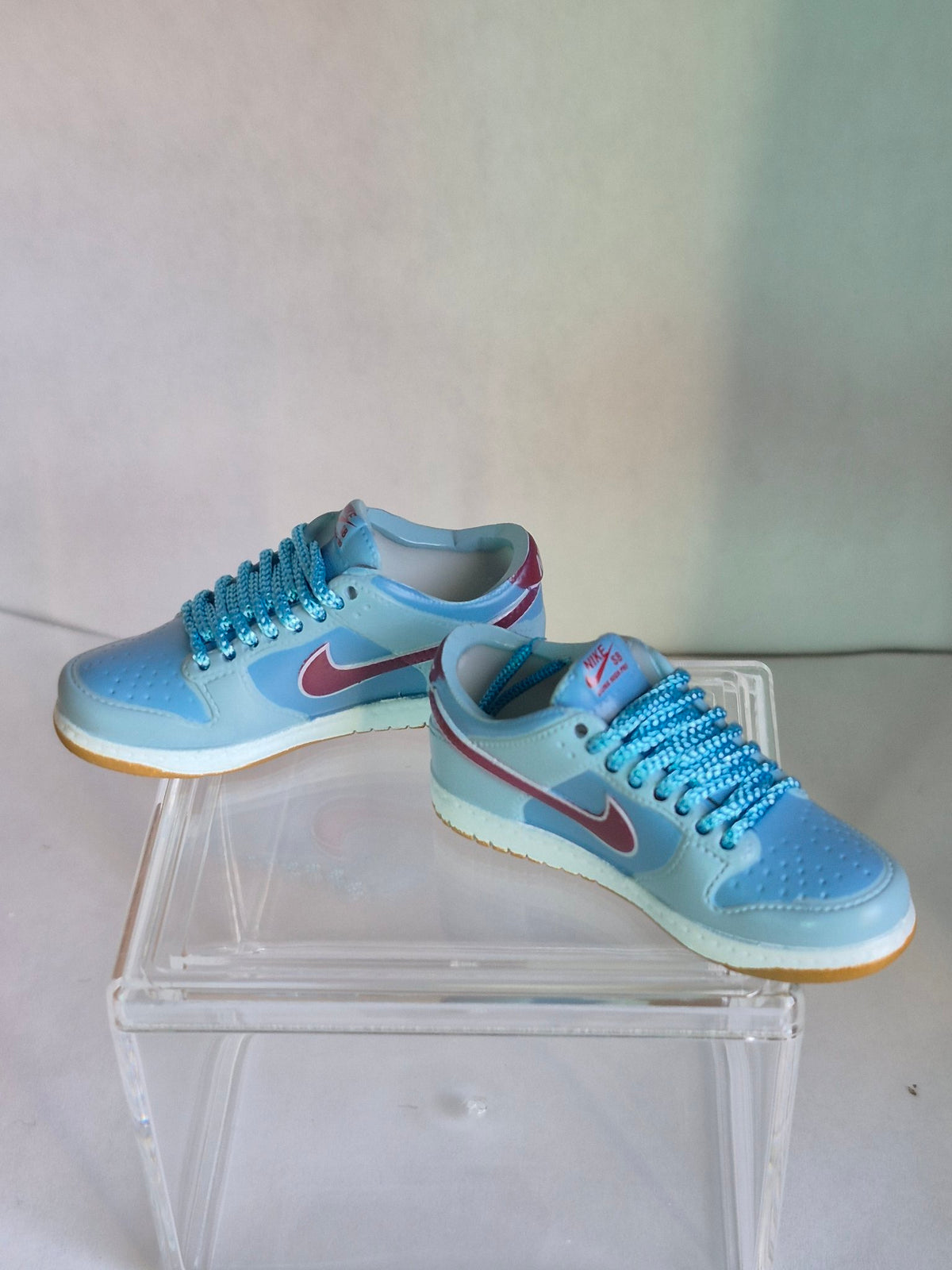 Light Blue Mini Sneakers with Burgundy Swoosh – Collectible Pair with Display Case