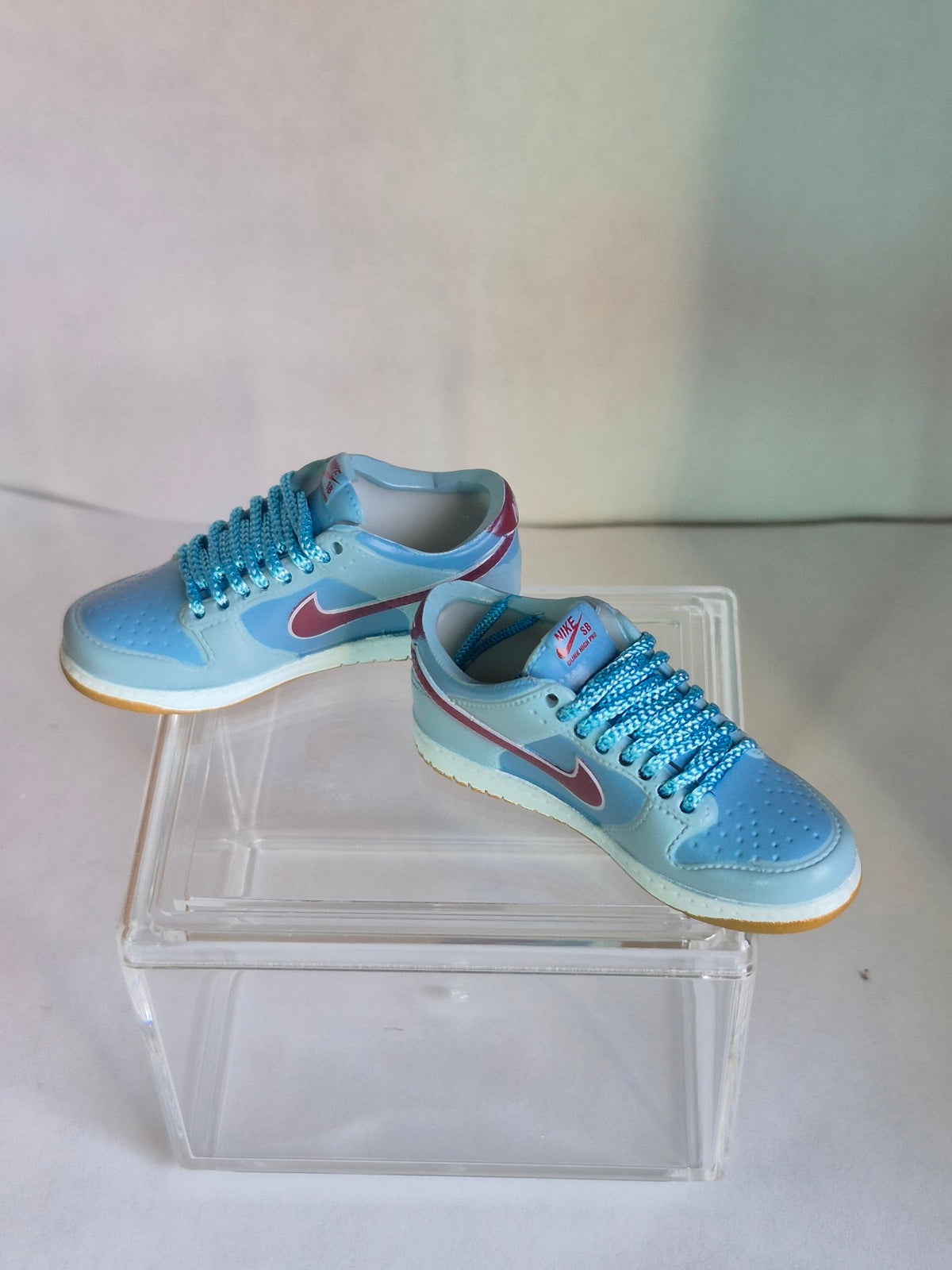 Light Blue Mini Sneakers with Burgundy Swoosh – Collectible Pair with Display Case