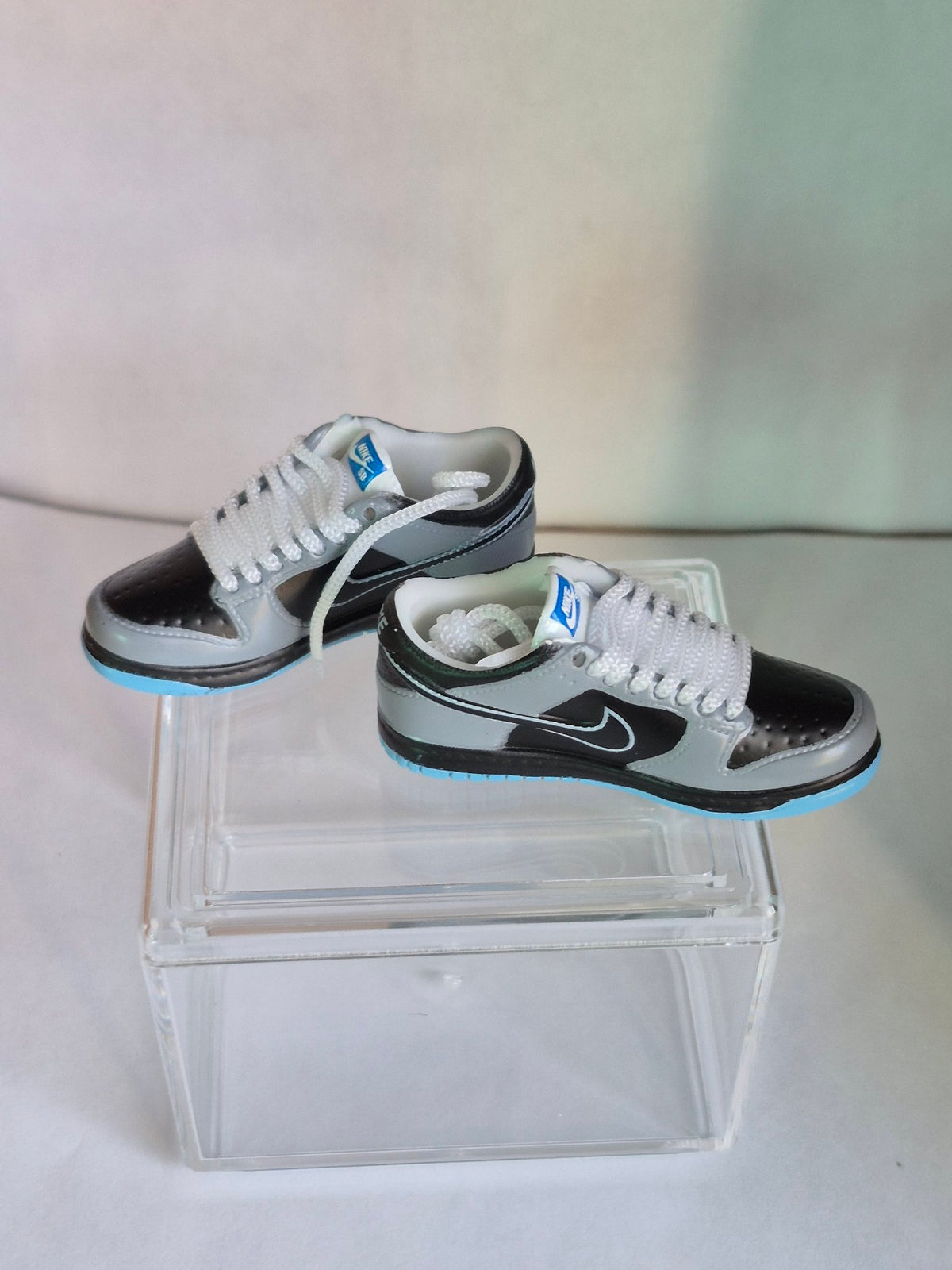 Gray and Black Mini Sneakers – Collectible Pair with Display Case