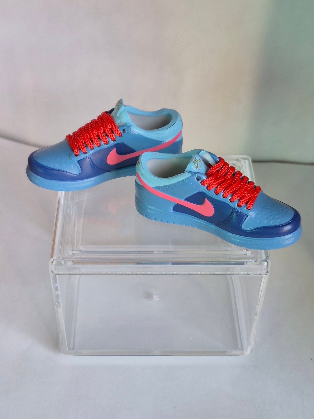Blue Mini Sneakers with Pink Swoosh – Collectible Pair with Display Case