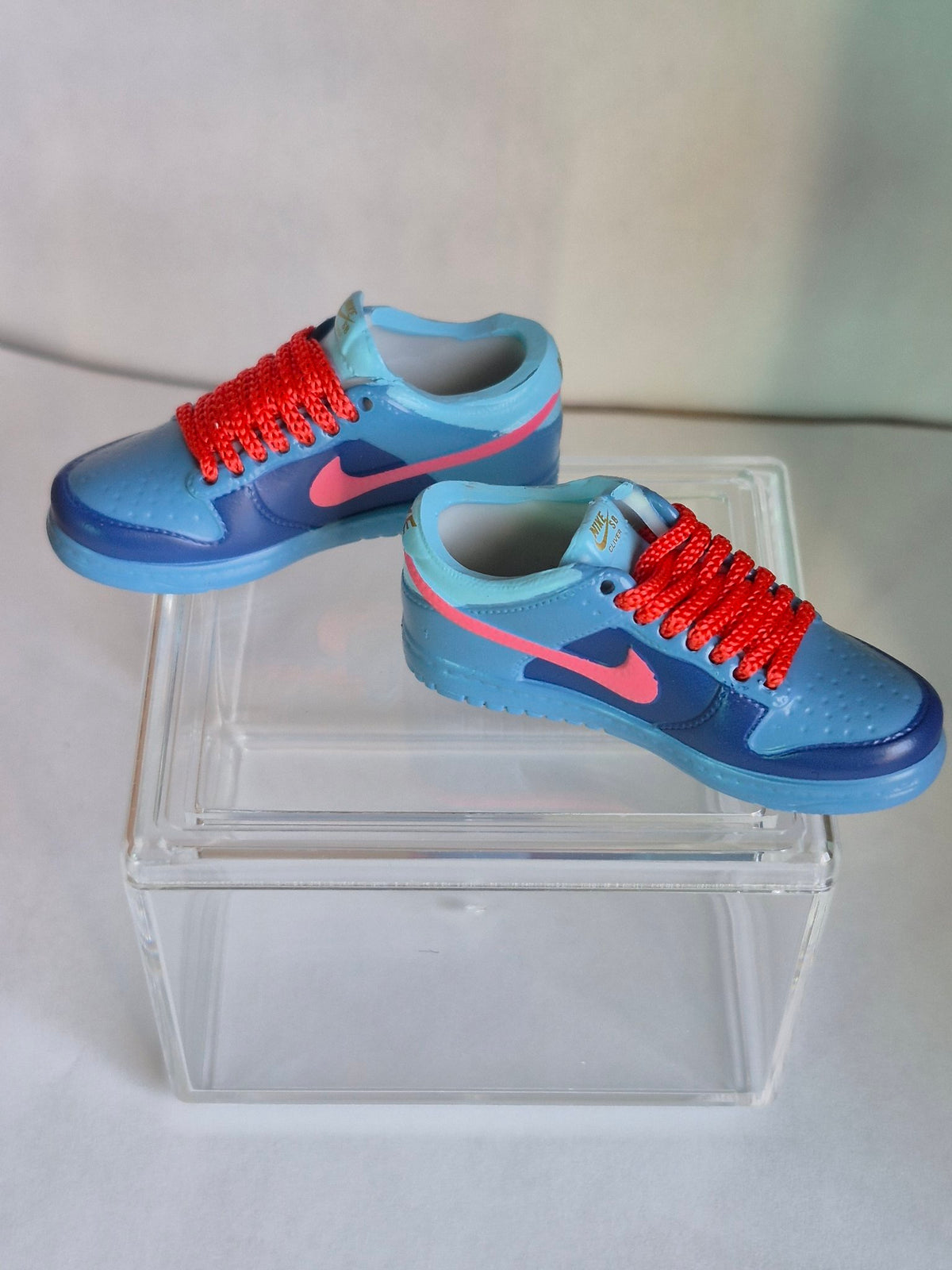 Blue Mini Sneakers with Pink Swoosh – Collectible Pair with Display Case