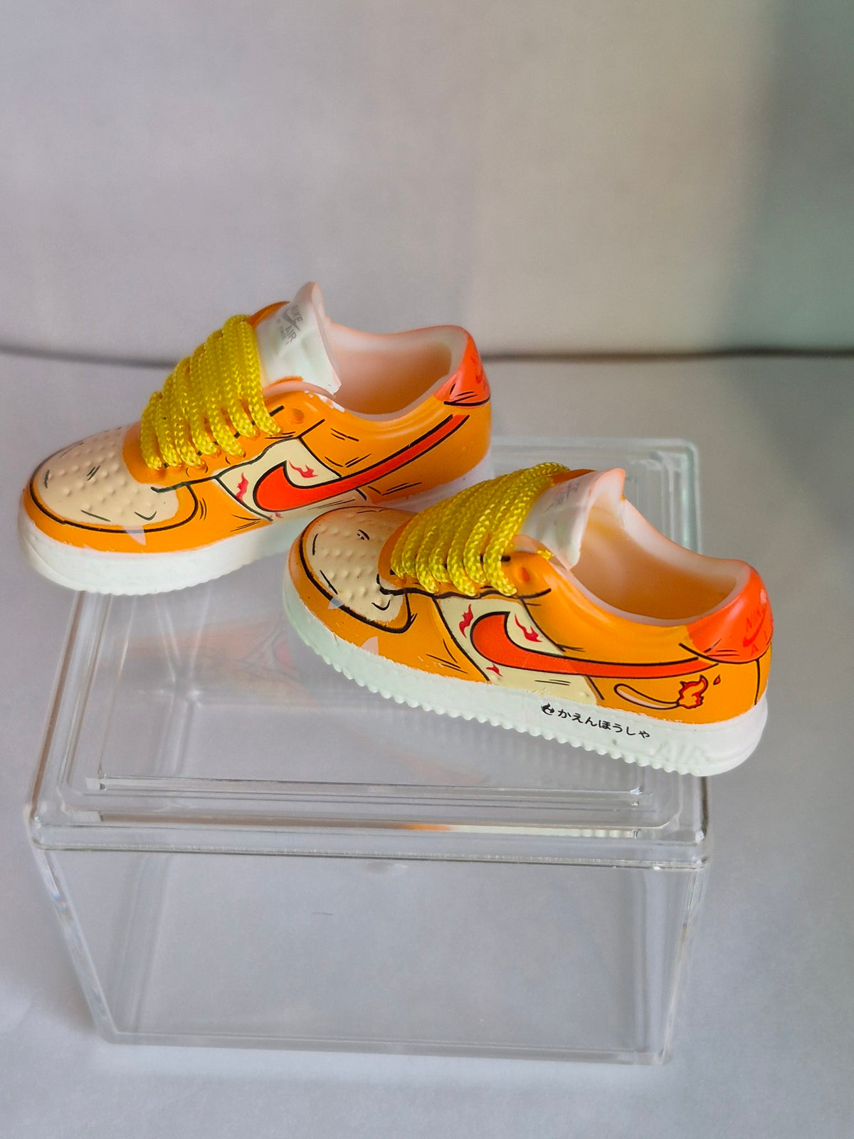 Orange Cartoon Flame Mini Sneakers – Collectible Pair with Display Case