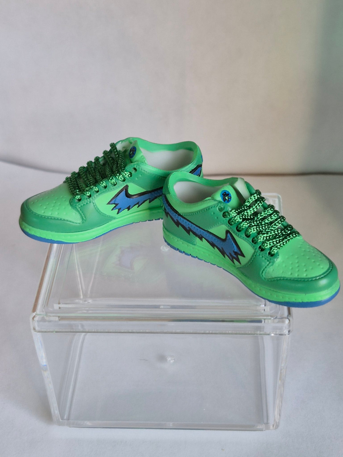 Green Mini Sneakers with Blue Lightning Swoosh – Collectible Pair with Display Case