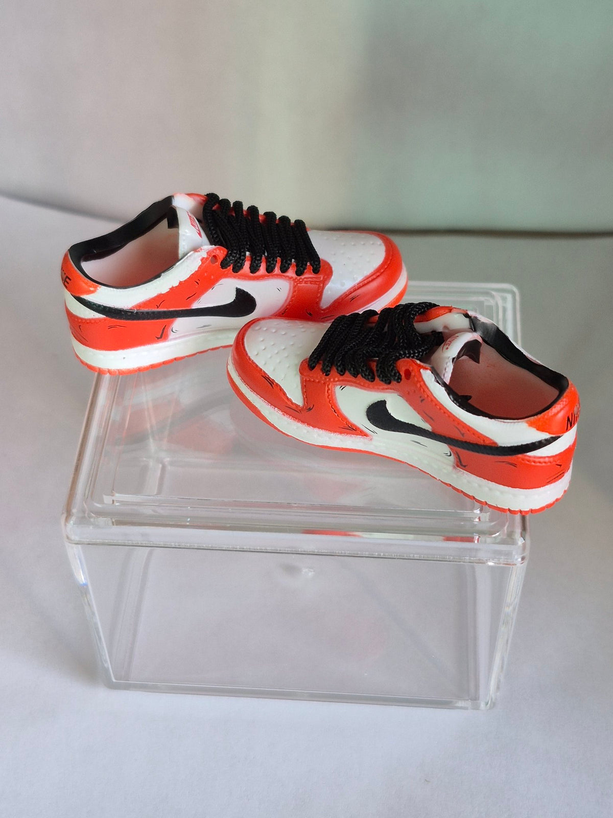 Orange and White Mini Sneakers with Black Swoosh – Collectible Pair with Display Case
