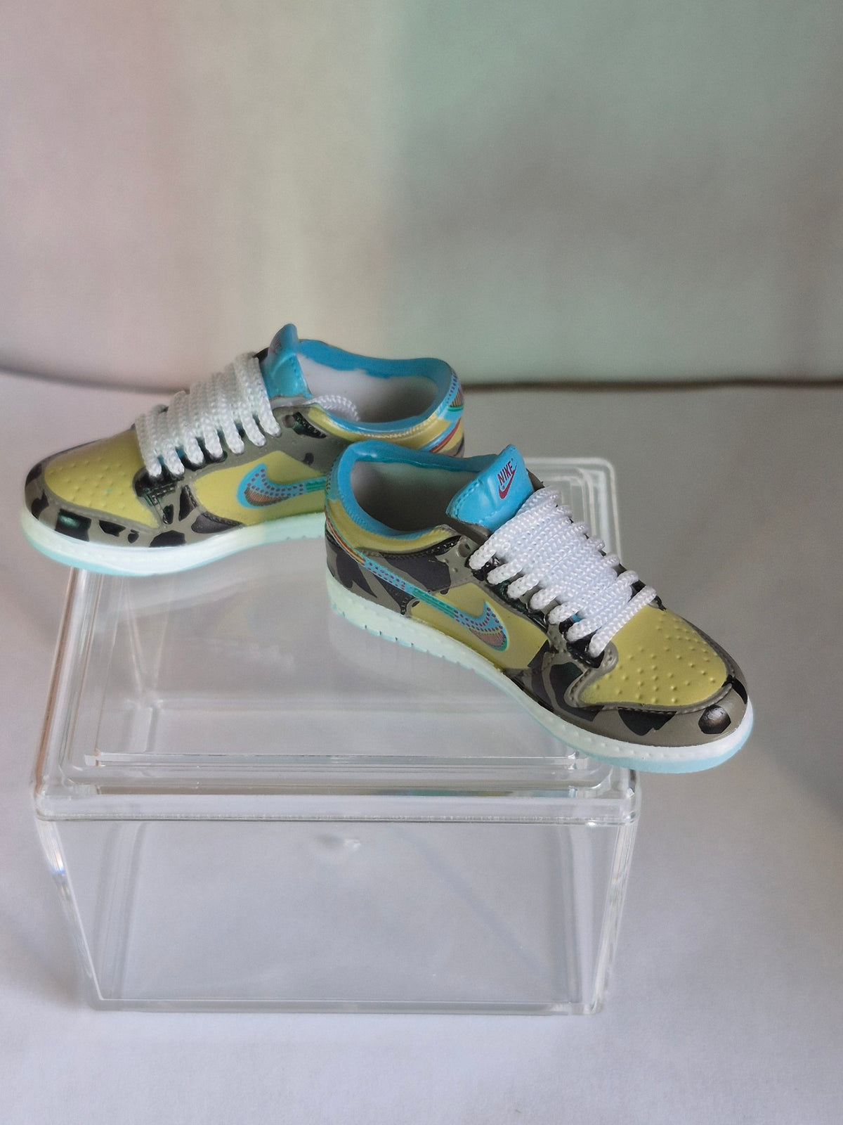 Orange and White Mini Sneakers with Black Swoosh – Collectible Pair with Display Case