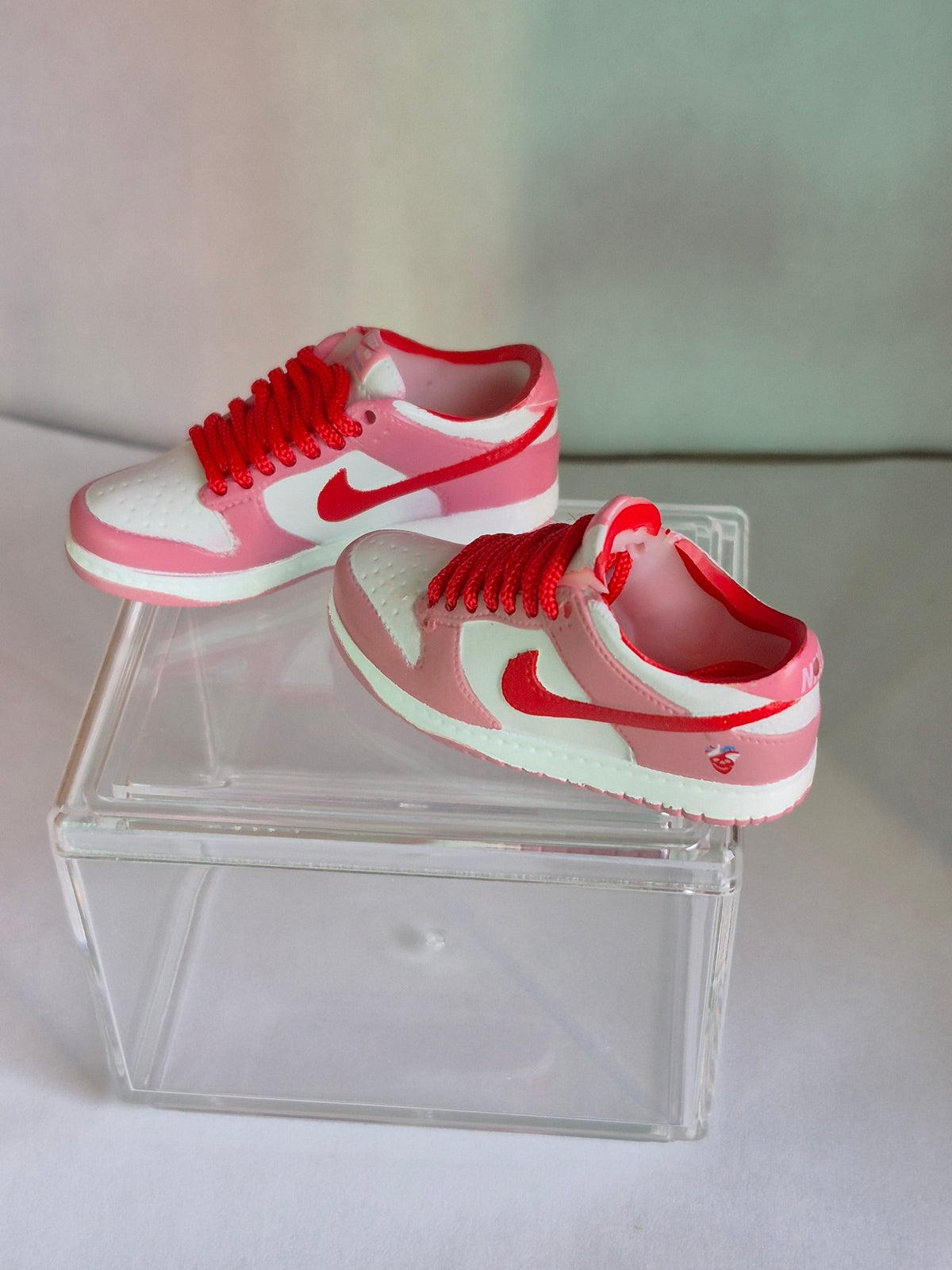 Pink and White Mini Sneakers with Red Swoosh – Collectible Pair with Display Case