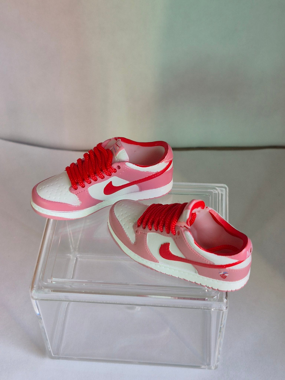 Pink and White Mini Sneakers with Red Swoosh – Collectible Pair with Display Case