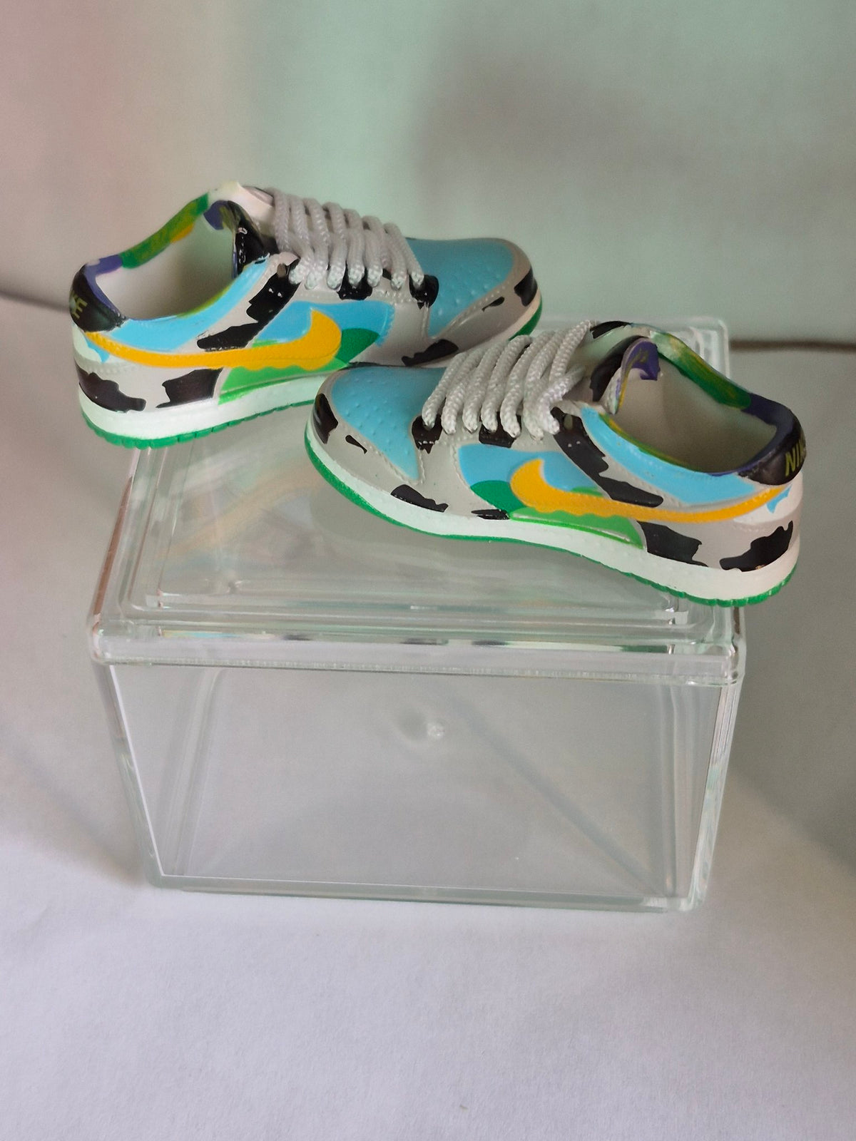 Cow Print Mini Sneakers with Yellow Swoosh – Collectible Pair with Display Case