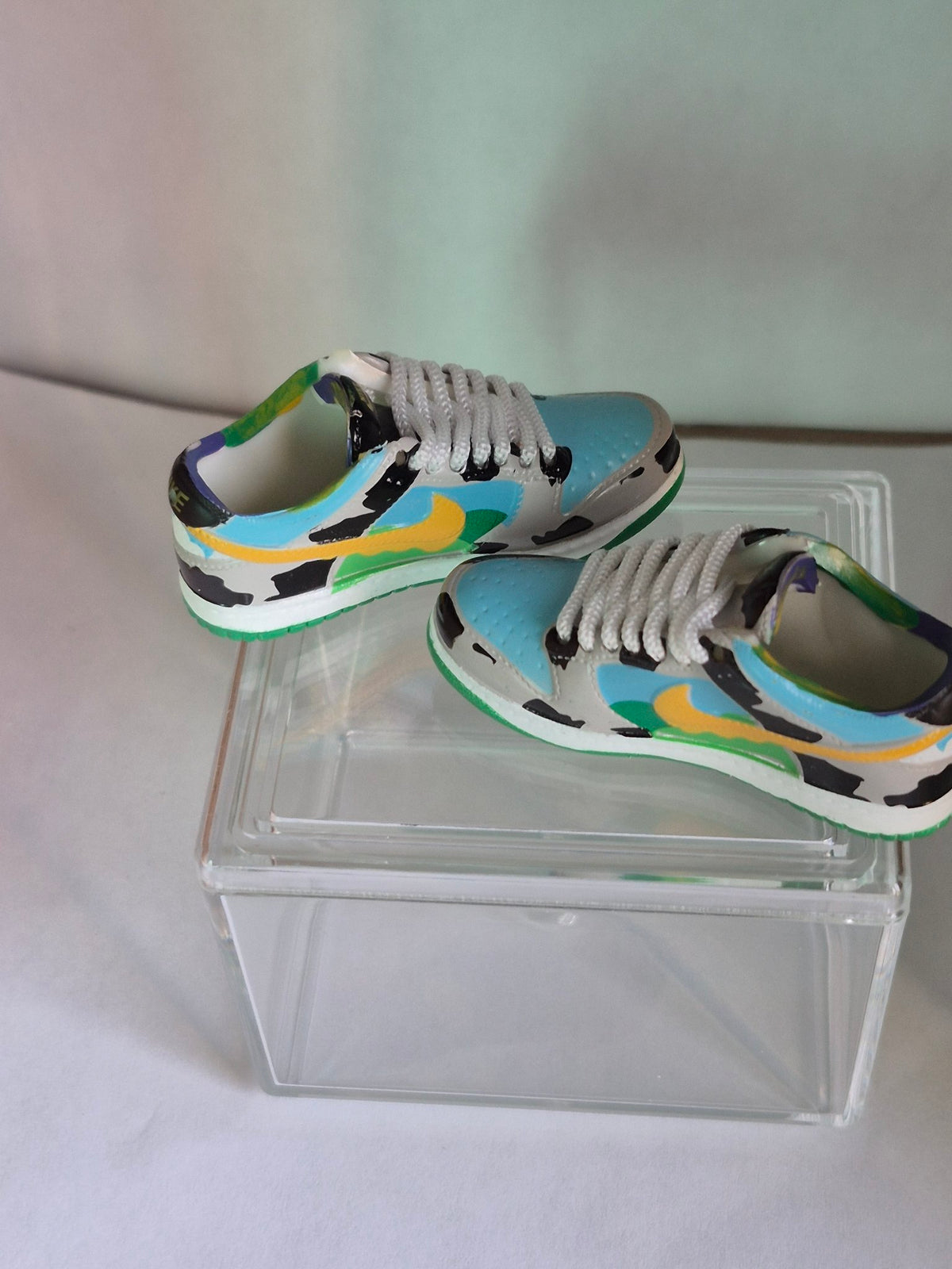 Cow Print Mini Sneakers with Yellow Swoosh – Collectible Pair with Display Case