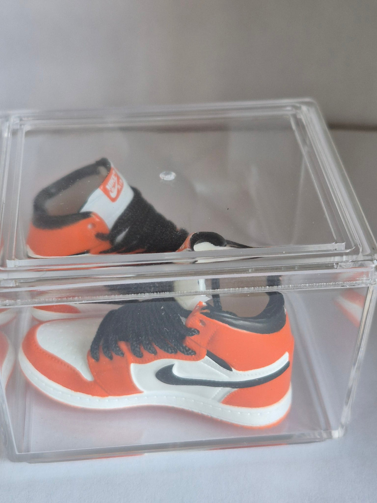 Orange and White High-Top Mini Sneakers with Black Swoosh – Collectible Pair with Display Case