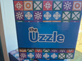 The Uzzle board game box front