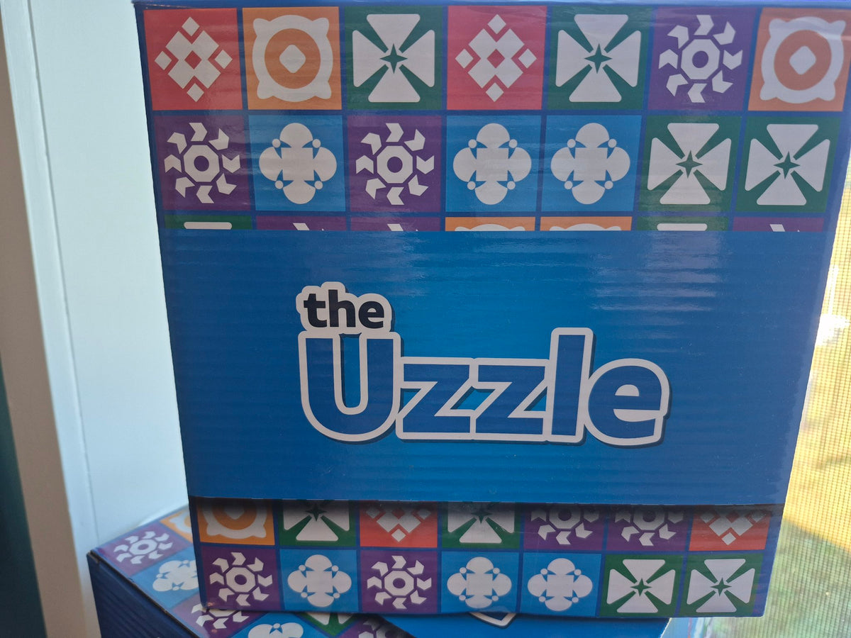 The Uzzle board game box front