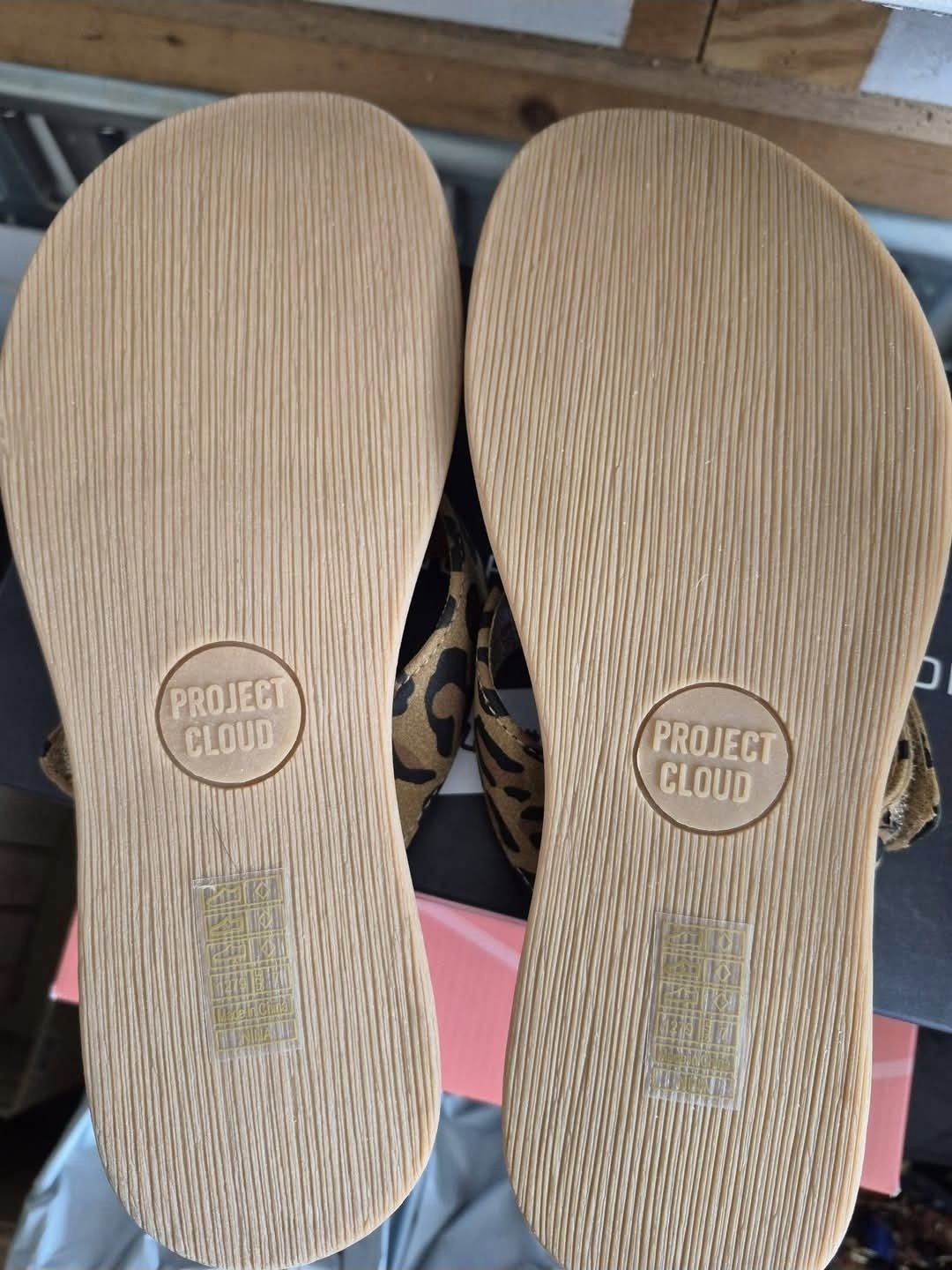 Project Cloud leopard print slide sandals, soles view