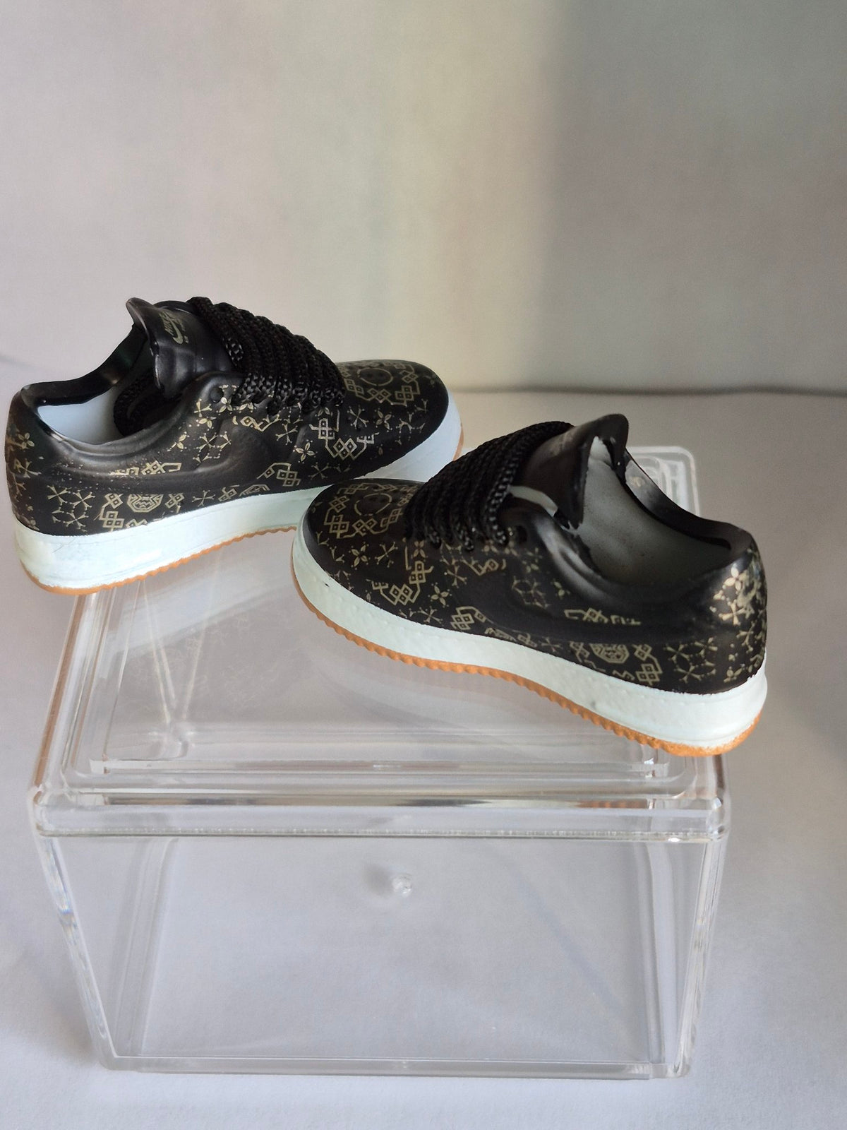Black and Gold Pattern Mini Sneakers – Collectible Pair with Display Case
